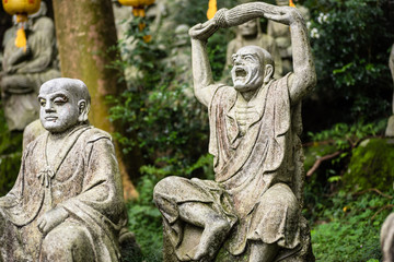 Fototapeta na wymiar groups of buddhist arhat stone statue