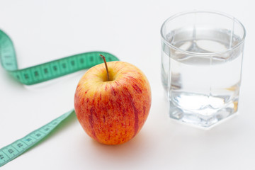 apple with measuring tape isolated on white