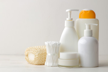 Personal hygiene products. Body care cosmetics. White bottles and vials on a light background. SPA. Relax.