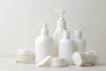 Personal hygiene products. Body care cosmetics. White bottles and vials on a light background. SPA. Relax.