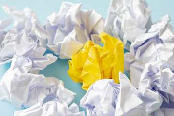 White and yellow paper crumpled concept idea of think different. 
