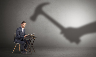 Shadow threatening hard worker man who is afraid