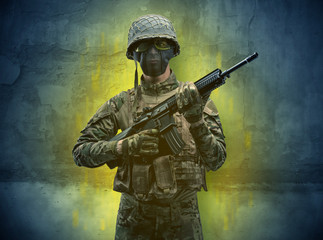 Hazard, menace soldier in a ruined crumbly building with arms on his hand