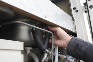 mechanical working on car close up. hands with tool