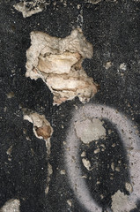 old black wall  with deteriorated paint