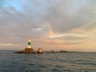 Fototapeta premium lighthouse and rainbow from Lake Michigan