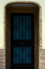 Fototapeta premium Entrance with blue and black door