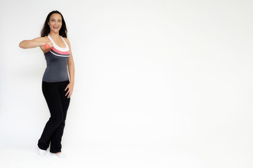 Full-length portrait on white background of beautiful pretty fitness girl woman in sports uniform, sitting on the stairs with different emotions in different poses. Stylish trendy youth.