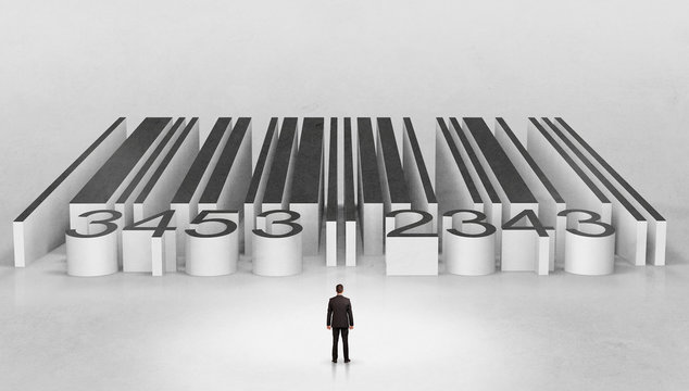 Young businessman standing in front of a big codebar