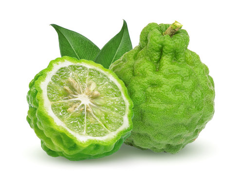 whole and half bergamot fruit with leaf isolated on white background