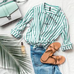 Feminine summer fashion composition: striped blouse, slippers, bag, sunglasses, watch, perfume,...