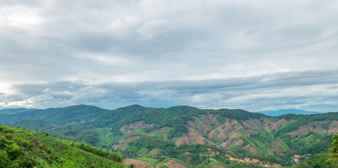 Obraz premium The mountain view with the nice sky of clouds in the warm sun light of afternoon 