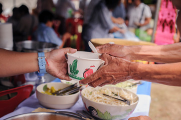 Social concept of poor people sharing : Concept serving free food to the poor : Free food, Using...