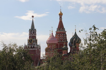Fototapeta na wymiar Russia, Moscow, view from Zaryadye Park on Kremlin tower and St. Basil's Cathedral on a summer day