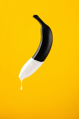 banana with condensed milk. concept penis and semen.