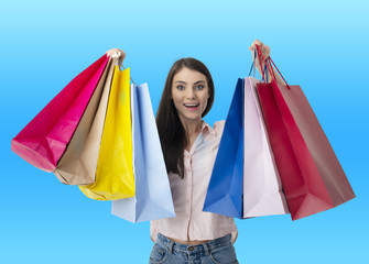 Happy woman with shopping bags in hand