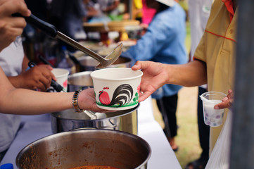 People outreach to donate food from volunteers : Food concept of hope : Free food for poor and homeless people donates food to food less people : Social concept of poor people sharing.