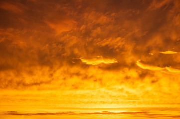 Orange sky Colorful sunset. Flaming orange clouds after rain.