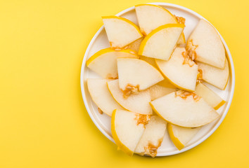 Sliced Yellow Musk Melon Served on Plate, Pastel Background and Copy Space