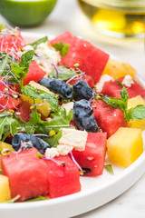 Serving Summer Fresh Watermelon Salad with Fresh Mint and Lime Juice