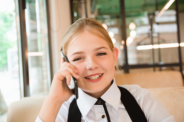 Charismatic girl as a businesswoman in cafe at lunch. Business youth.