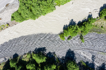 amazing view of the confluence of two rivers with different colors of water. The two mountain...