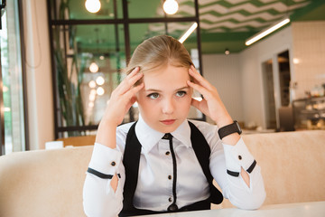 Charismatic girl as a businesswoman in cafe at lunch. Business youth.