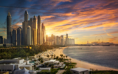 Dubai, UAE United Arabs Emirates. City of skyscrapers, Dubai marina at sunset. Front line beach hotels and blue water of Persian gulf 