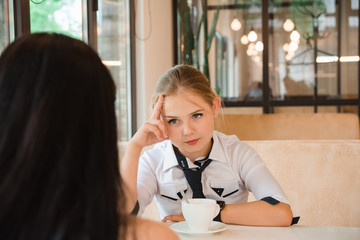 Charismatic girl as a businesswoman in cafe at lunch. Business youth.