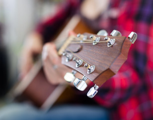 close-up of wooden fretboard of guitar