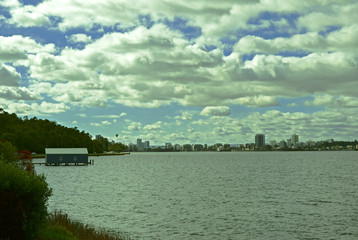 View of Crawley Edge Boatshed, Blue Boat House with blue sky and white cloud in Perth, Australia