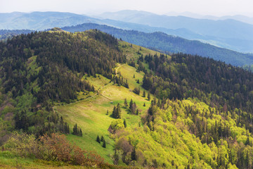 Warm summer season in the Ukrainian Carpathians with view of the observatory White elephant and tourist with a tent against the background of the mountains	