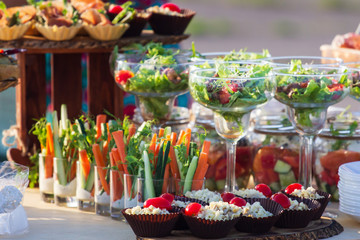 catering table set service with silverware and glass stemware at restaurant before party