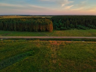 sunset over green field