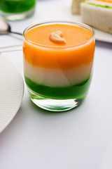 Tiranga / Tricolour sweet food made using indian flag colours and served in a glass in layers....