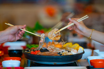 Selective focus Shabu Shabu and Sukiyaki, Japanese food with grill and pot boil