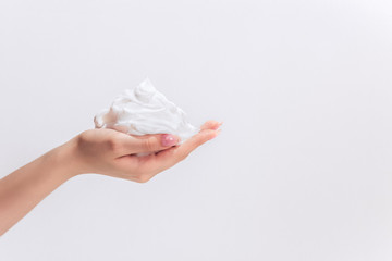 white bubbled foam in hand, hair foam, foam for man, white textured, hand full of soap isolated on white background