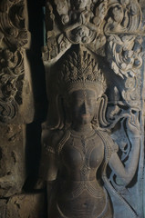 Sculptured wall at Angkor Wat. An Apsara or angel with nice hair style