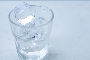 Glass with ice put on table.