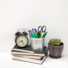 Workplace office worker with accessories and white desk.