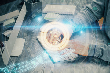 Blockchain theme hud with businessman working on computer on background. Concept of crypto chain....