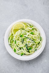 Green vegetarian pasta. Spiralized zucchini noodles with mint, lemon and parmesan cheese