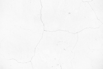 background cracked white wall. White plaster cracked. Cracks on the white wall. Grid on a white plaster wall texture.