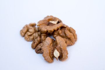 Close-up of walnut kernels on white background