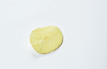 crispy salt potato chips on white background