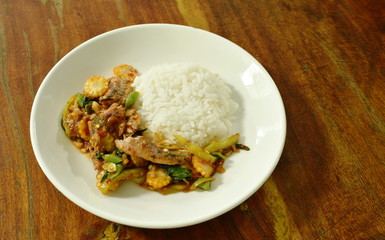 spicy stir fried canned sardines fish with chili and basil leaf on rice