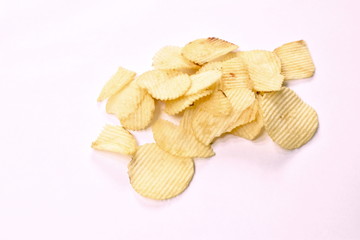 crispy salt potato chips on white background