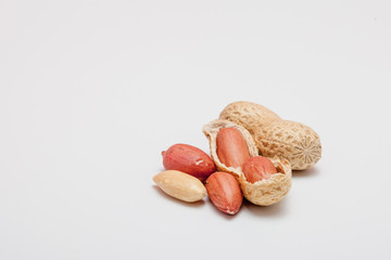 Large peeled peanuts close-up of beans in the shell. Unpeeled peanuts in the shell. Peanuts, for...