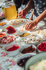 Male chef preparing dough for pizza in outdoor market. Street food.
