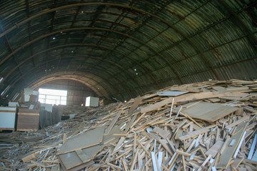 Taking photographs of wood plywood, used for making pellets